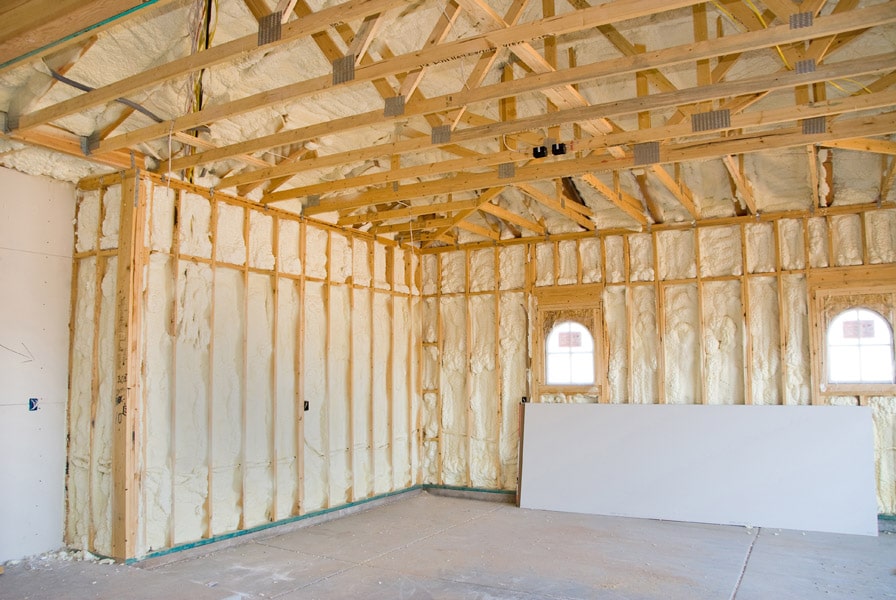 A room at a newly constructed home is sprayed with foam insulation in San Antonio TX